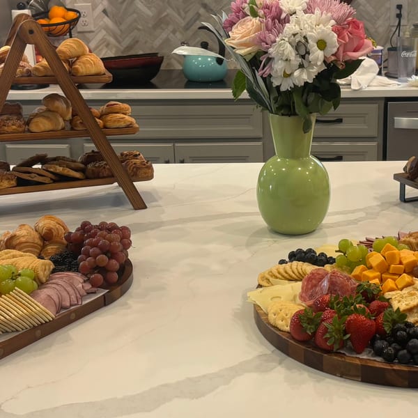 Charcuterie spread with pastries, fruit and dessert tiers